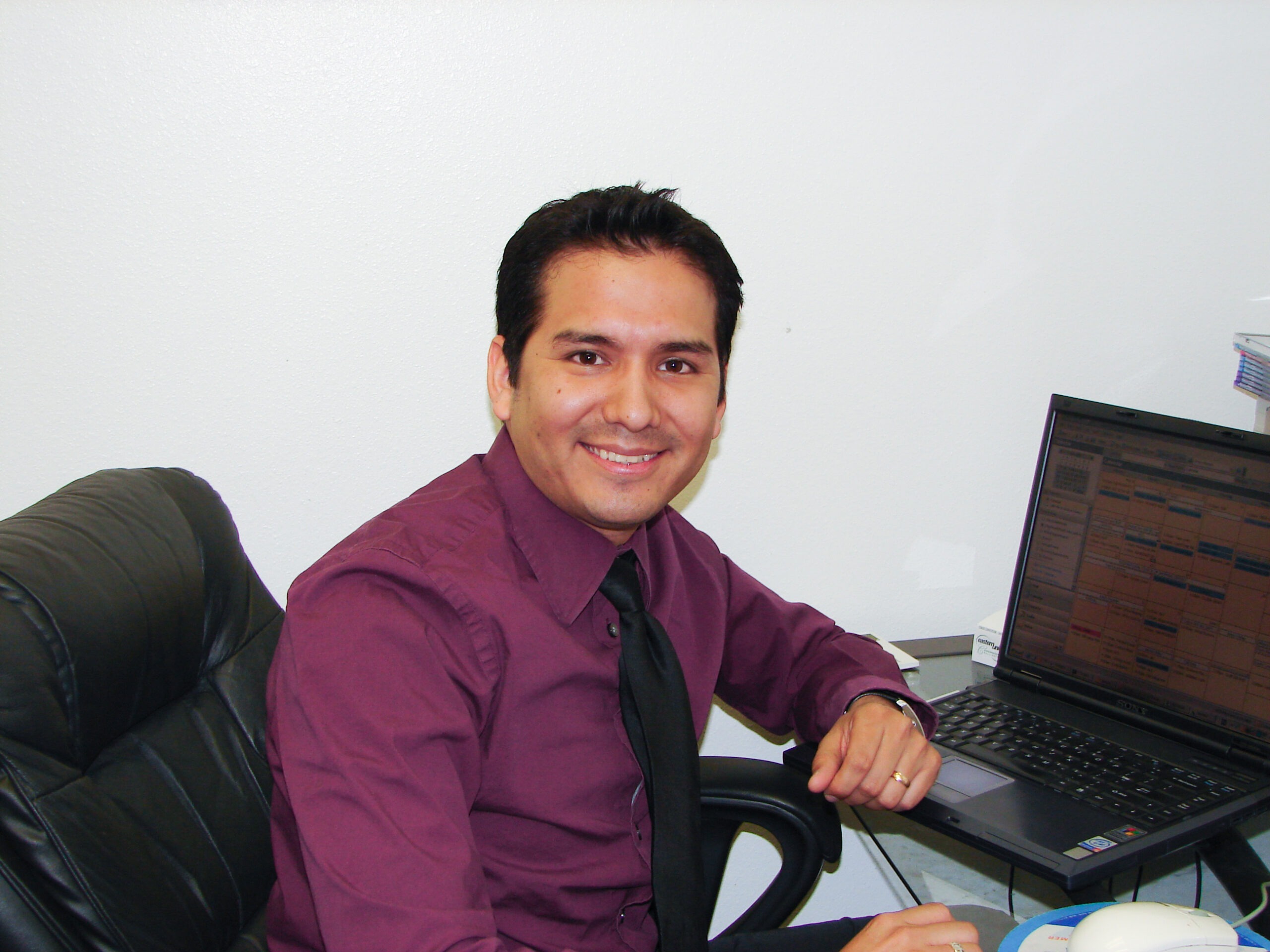 Manuel Oblitas at VND's office inside Apartment Listing Service, 2006